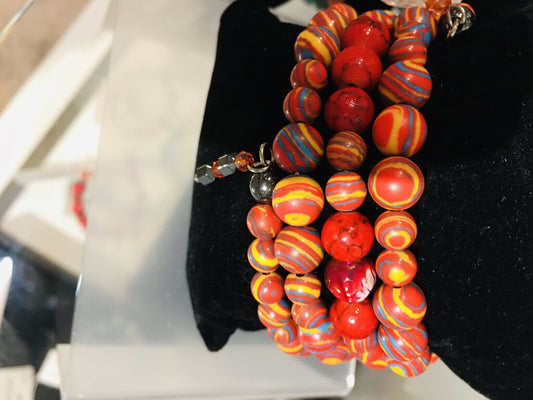 4 strand memory wire bracelet; red simulated malachite beads;
